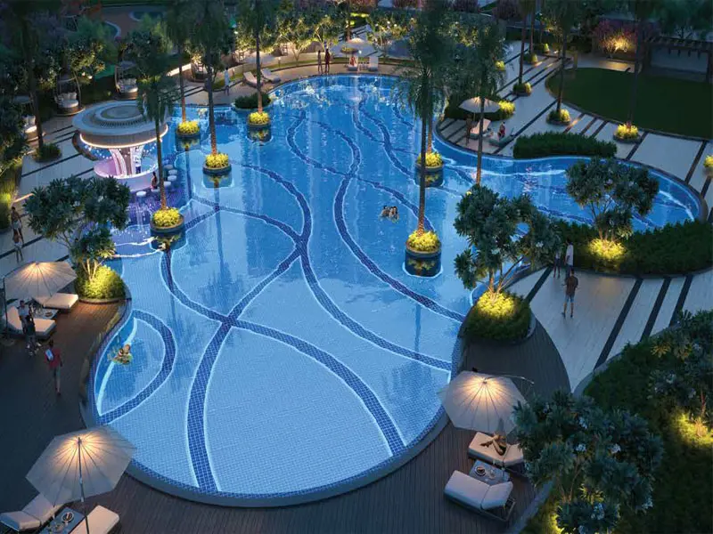 Artist's impression of Smartworld One DXP Sector 113 Gurgaon free-form swimming pool with landscaped resort-style surroundings